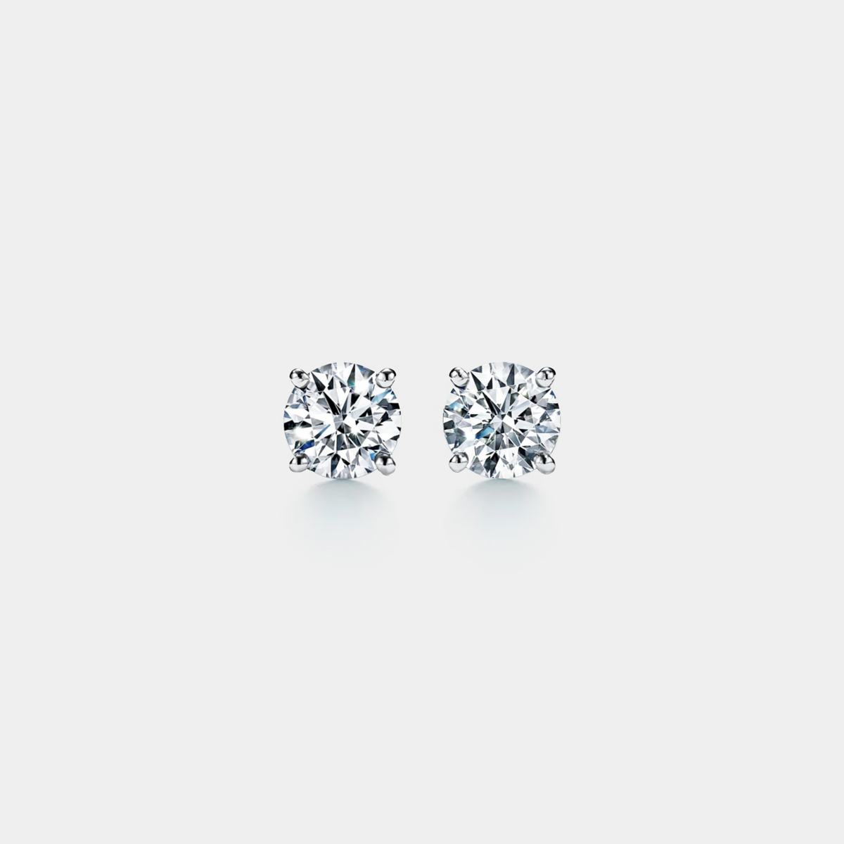 Four-Prong Moissanite Stud Earrings in 925 Sterling Silver: Silver / 1.6 ct